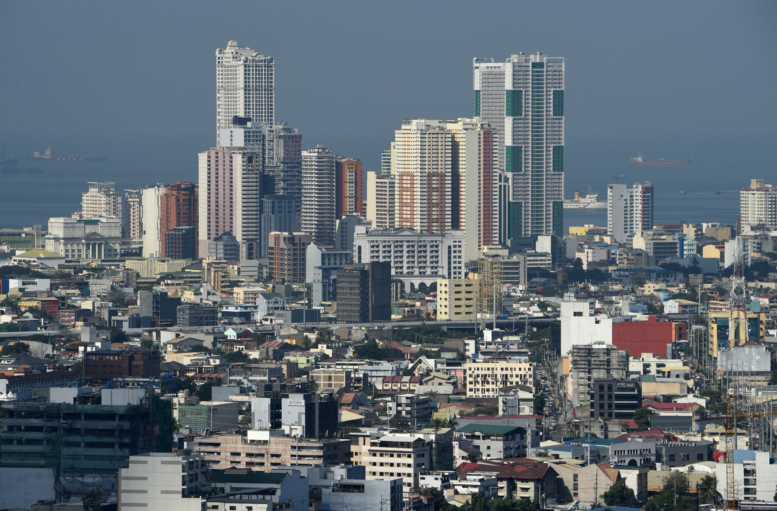 This photo taken on January 29, 2019 shows a general view of the skyline of Manila. (Photo by Ted ALJIBE / AFP)