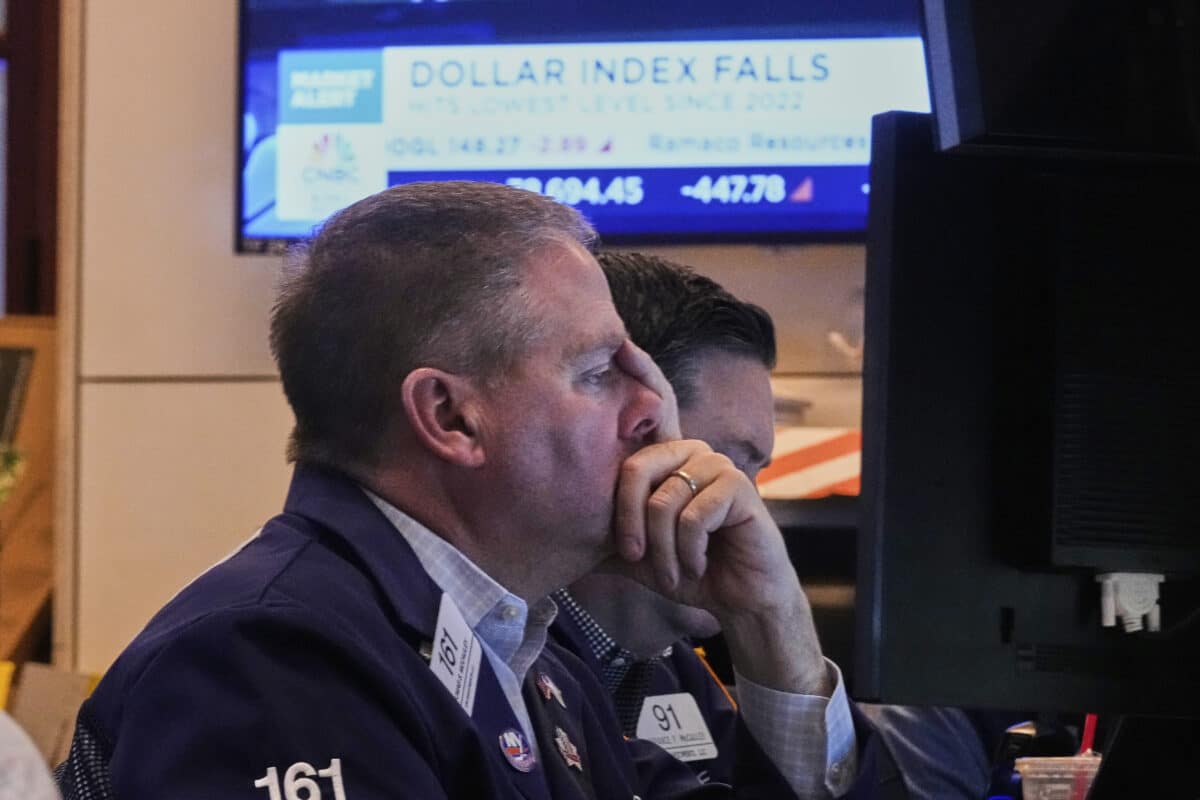 Trader Thomas McCauley works on the floor of the New York Stock Exchange, Monday, April 21, 2025. (AP Photo/Richard Drew)