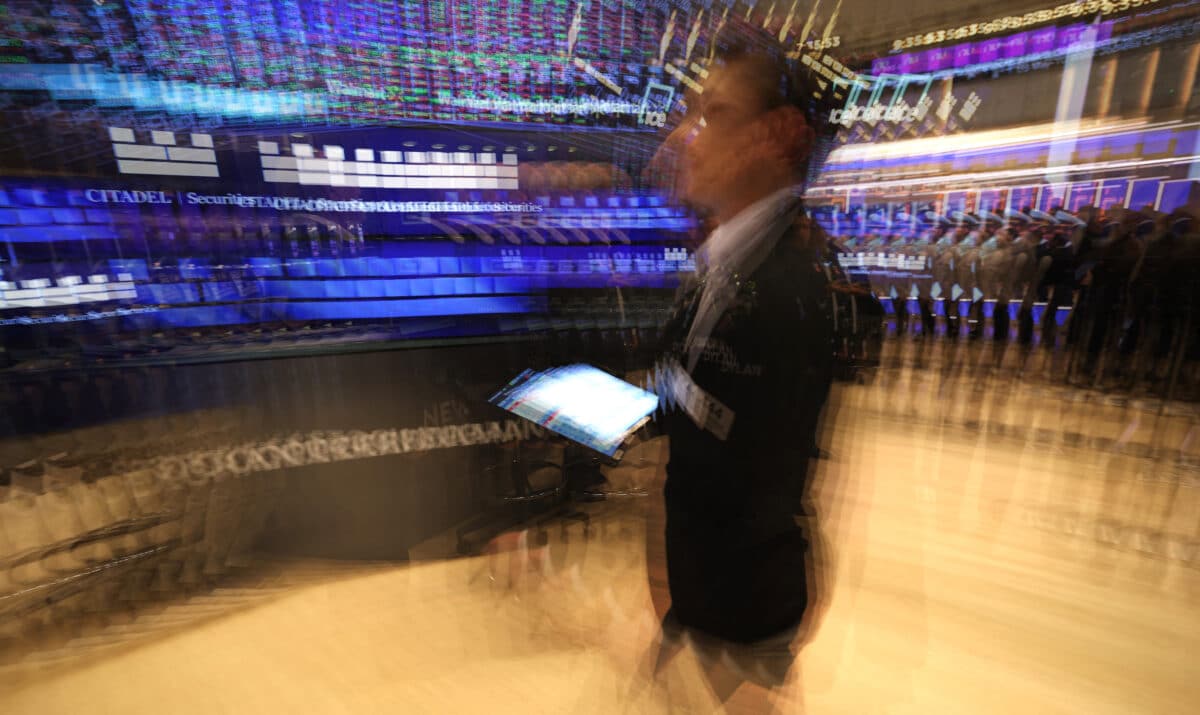 Traders work on the floor of the New York Stock Exchange (NYSE) at the opening bell on May 23, 2025, in New York City. Wall Street stocks opened lower May 23 after the opening bell, the S&P 500 was down 1.2 percent after US President Donald Trump warned of 50 percent tariffs on EU goods and 25 percent tariffs on Apple. (Photo by TIMOTHY A. CLARY / AFP)
